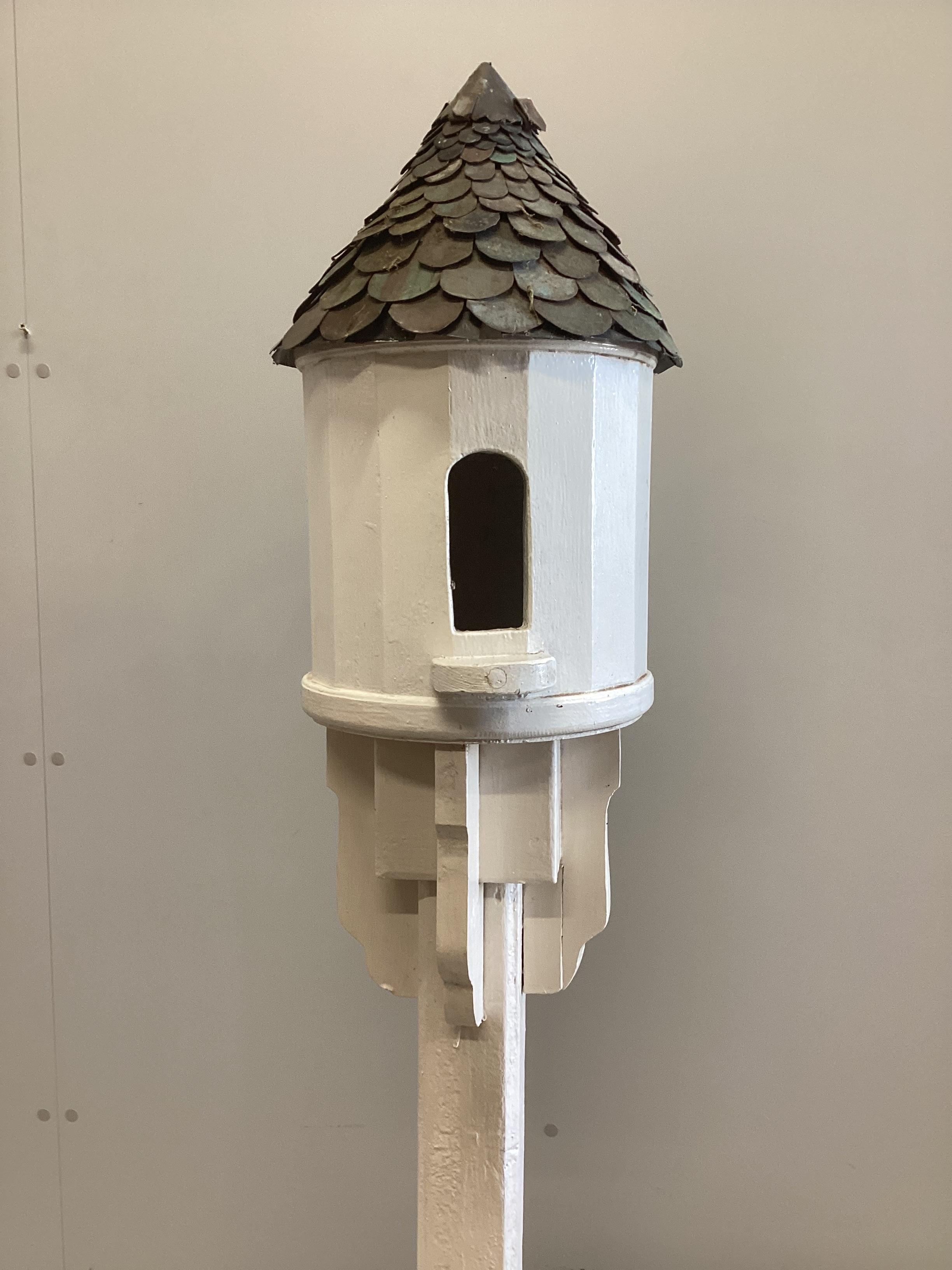 A painted wooden dovecote with scaled copper roof, height 190cm